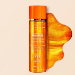 Esthederm Adaptasun Golden Glow Hydra-Protective Shimmering Sun Care Body Oil, olejek rozświetlający z wysoką ochroną, 125 ml