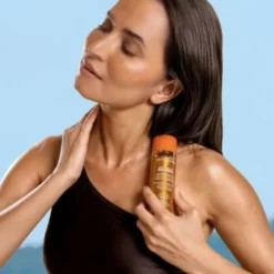 Esthederm Adaptasun Golden Glow Hydra-Protective Shimmering Sun Care Body Oil, olejek rozświetlający z wysoką ochroną, 125 ml