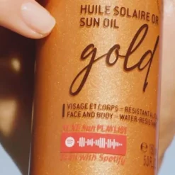 Nuxe Sun, rozświetlający olejek do opalania twarzy i ciała z drobinkami, SPF30, 150 ml